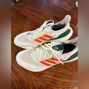 Adidas White and Green Shoes with Vibrant Orange Details
